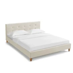 Lit en velours avec pieds en bois